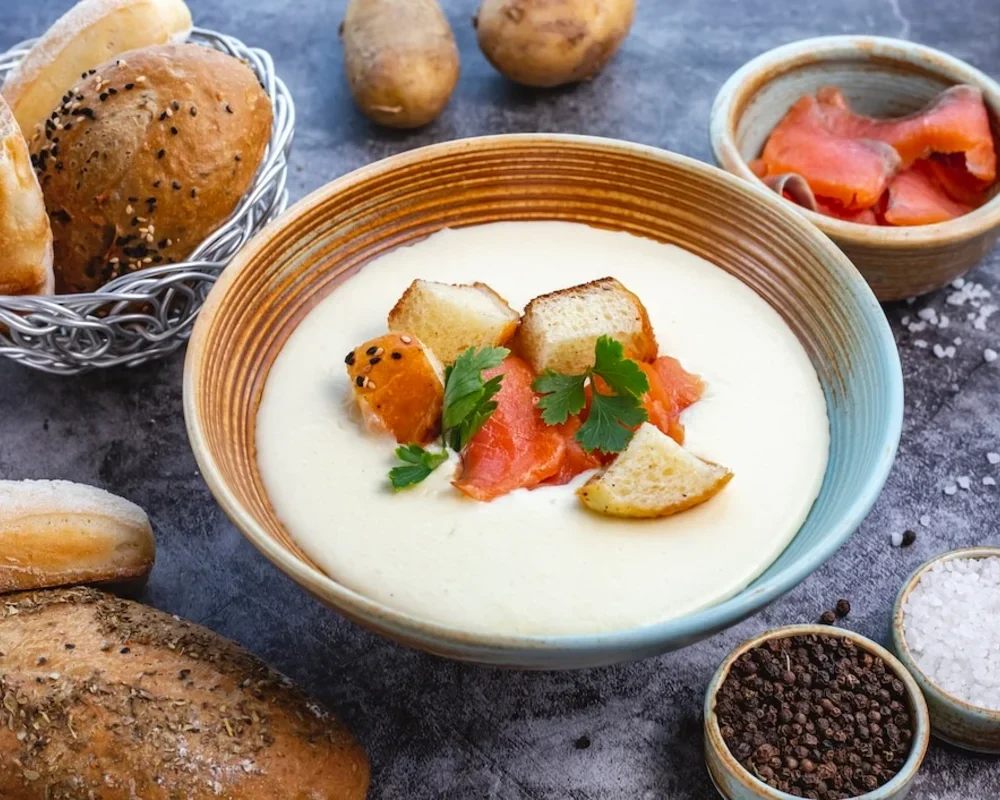 Delicious creamy potato and hamburger soup topped with fresh parsley.