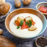 Delicious creamy potato and hamburger soup topped with fresh parsley.