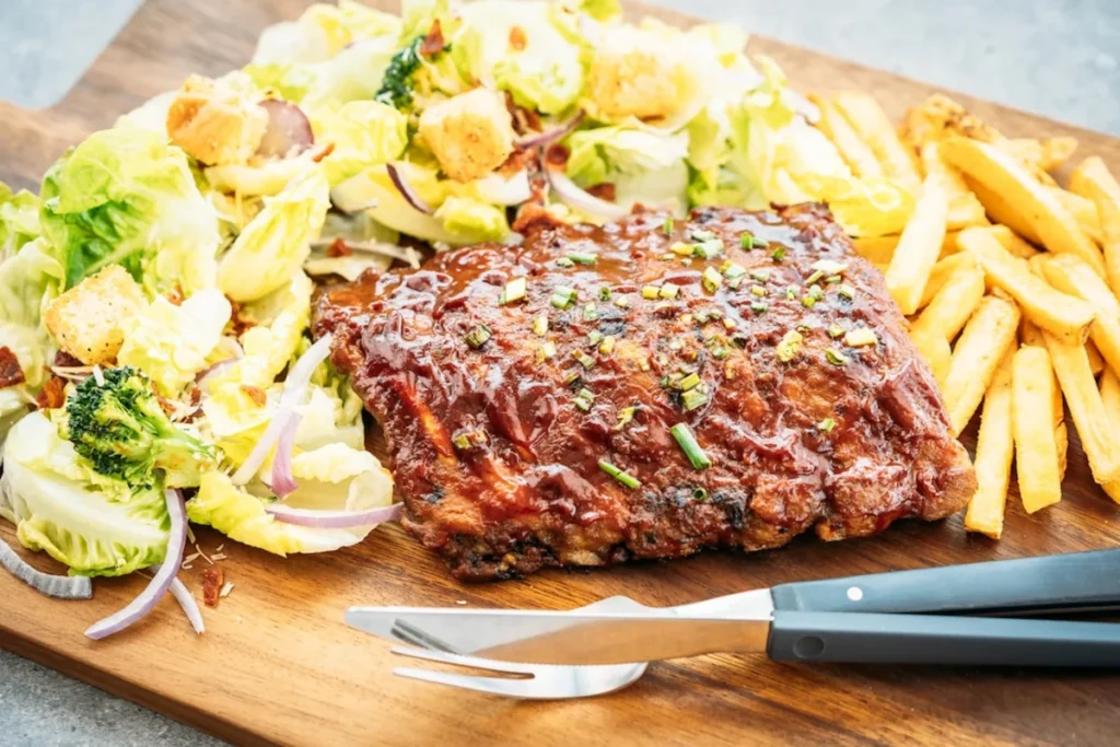 Delicious French Onion Meatloaf with a cheesy topping and onion garnish.