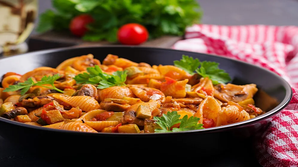 Strozzapreti Norcina pasta served in a traditional dish.