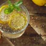 A refreshing glass of Chia Water with chia seeds and a hint of lemon, a perfect healthy drink.