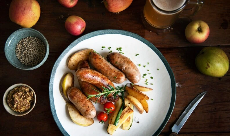 A delicious serving of Chicken Apple Sausage with sautéed vegetables, a healthy and flavorful dish.