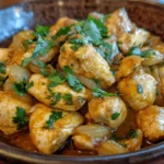 Churu Chicken Amarillo served with traditional Peruvian rice and garnished with cilantro.