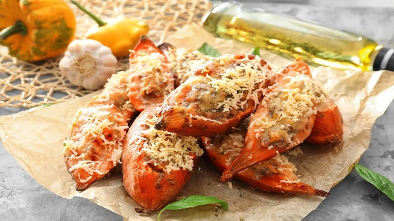 Close-up of garlic butter lobster tails with a golden finish.